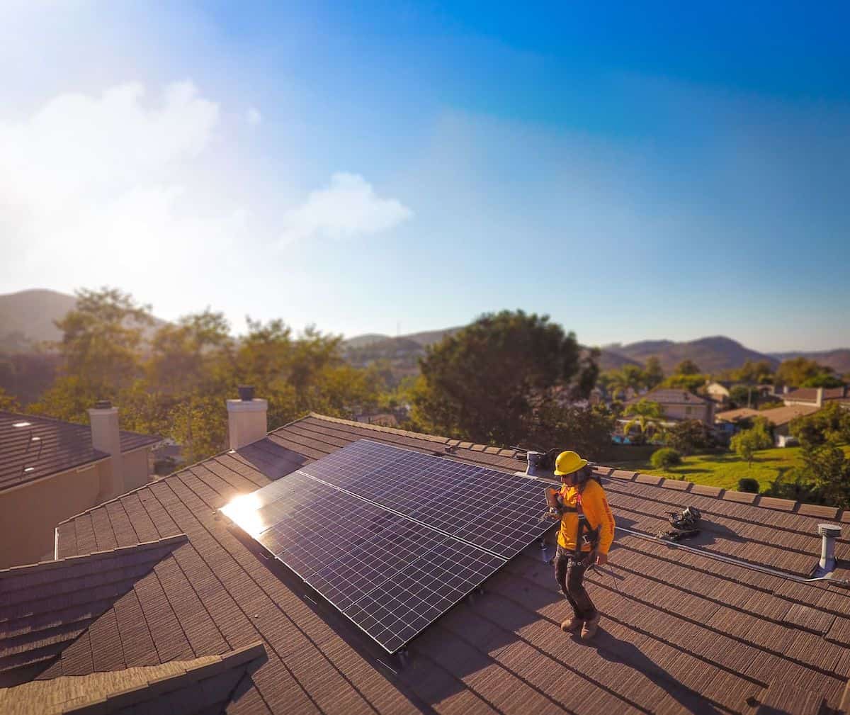 Man installing solar on rooftop