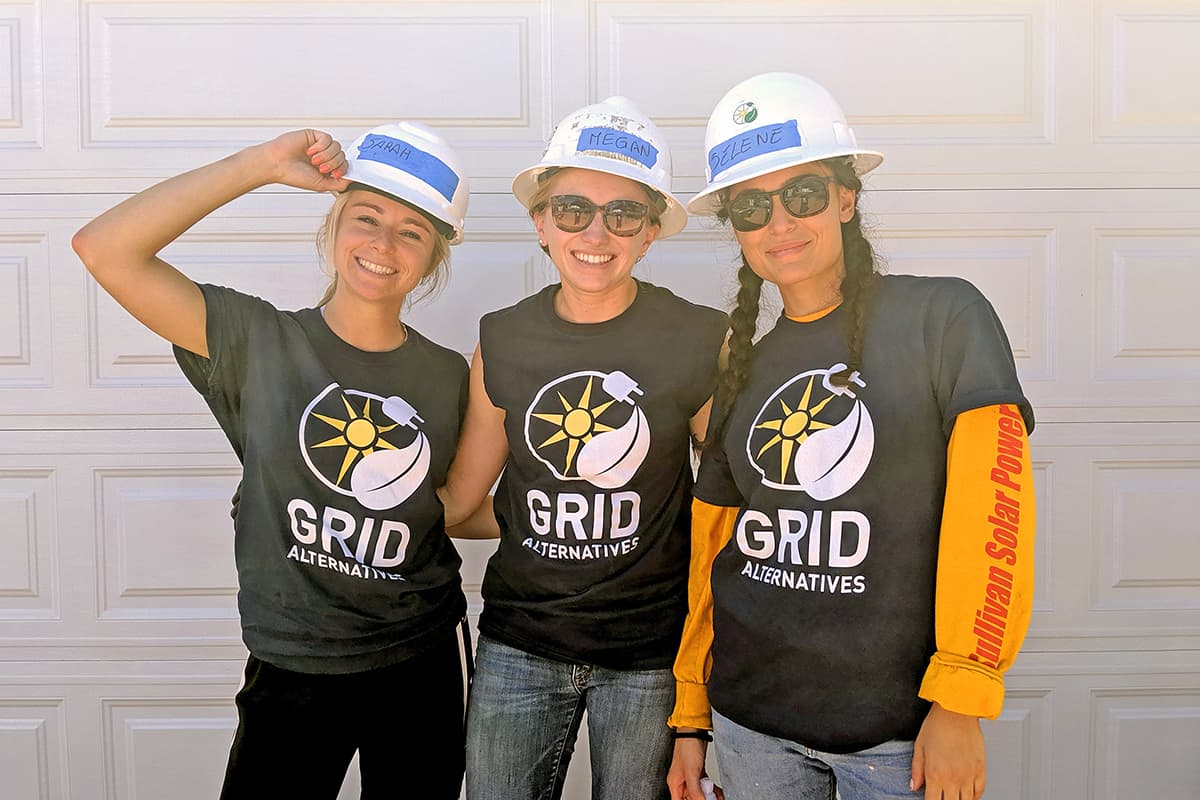 Three Sullivan Community Developers wearing hard hats smiling for photo
