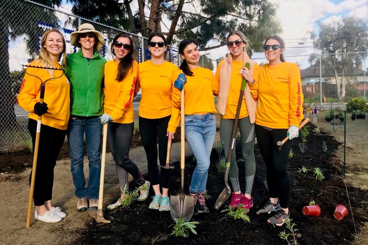 Picture of Sullivan Solar Power's community development team planting a garden at San Diego area school