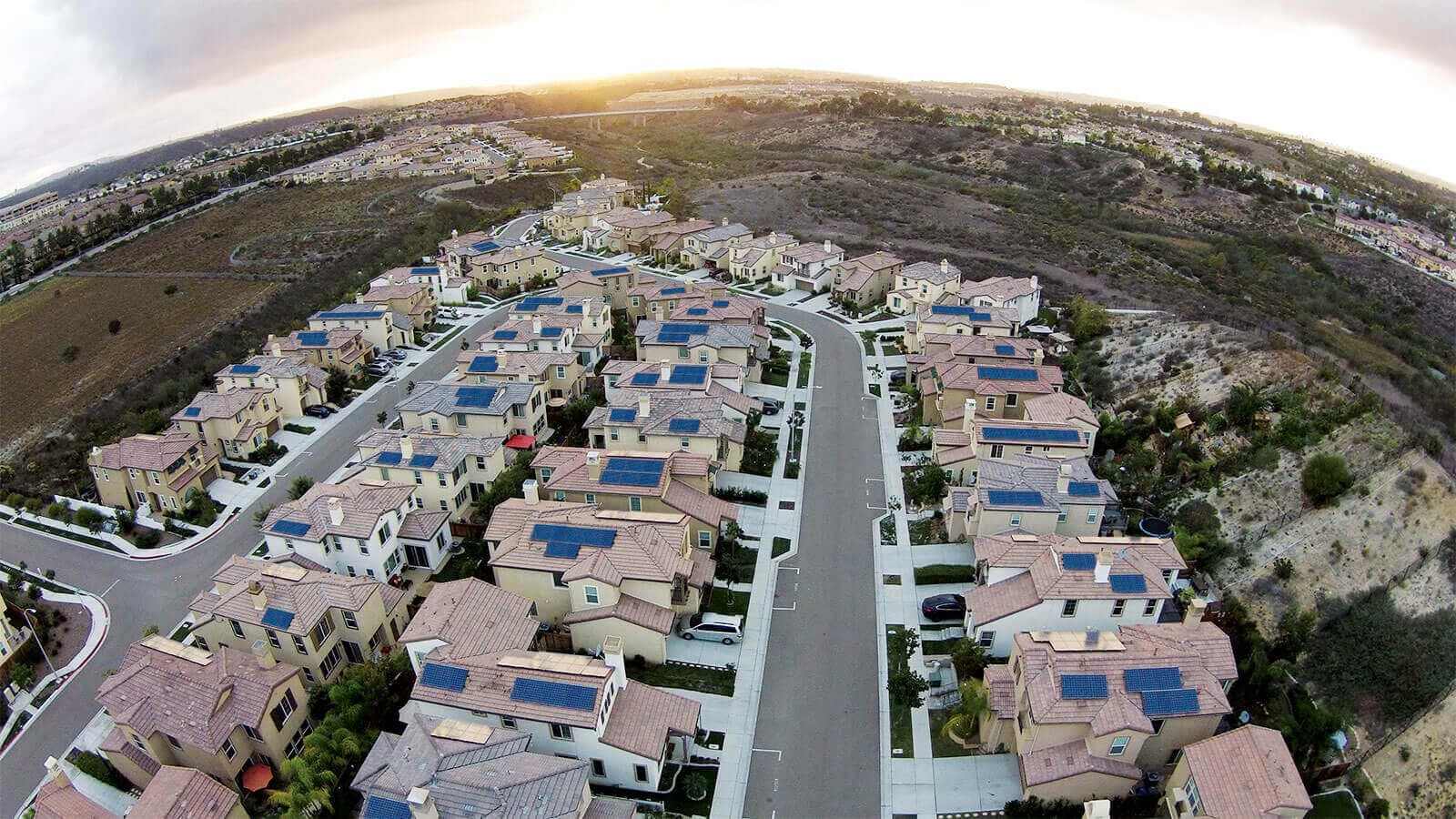 Aerial photograph of rooftop solar powered community